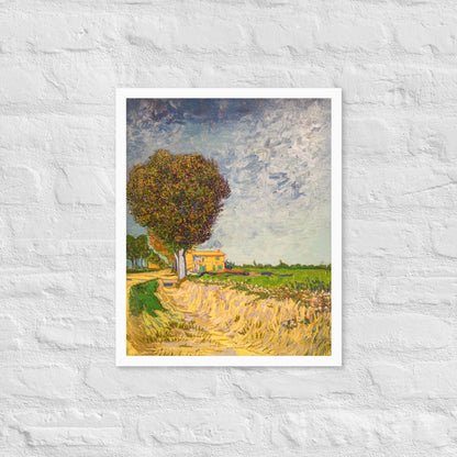 Van Gogh's 'A Lane near Arles' on a 16"x20" white framed poster print on a white brick wall.