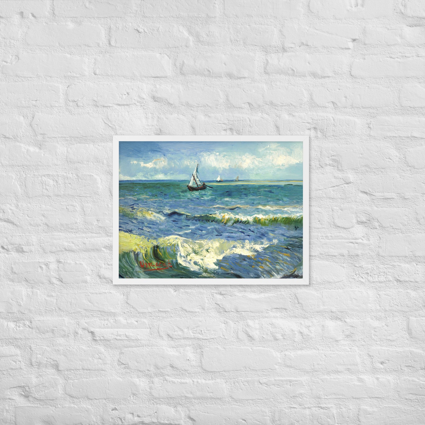 Van Gogh's 'The Sea at Les Saintes-Maries-de-la-Mer' on a 18"x24" white framed poster print on a white brick wall.