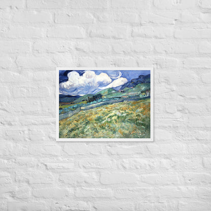 Van Gogh's 'Landscape from Saint-Rémy' on a 18"x24" white framed poster print on a white brick wall.