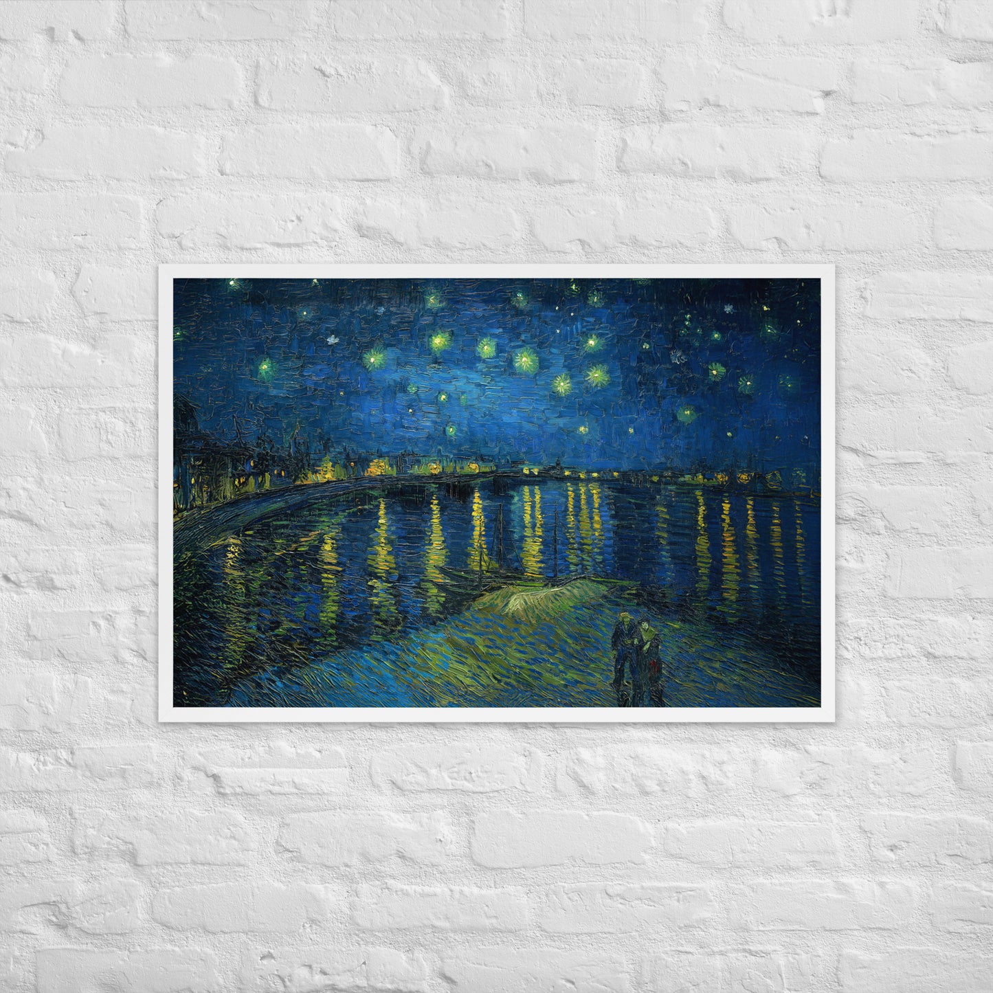 Van Gogh's 'Starry Night Over the Rhone' on a 24"x36" white framed poster print on a white brick wall.