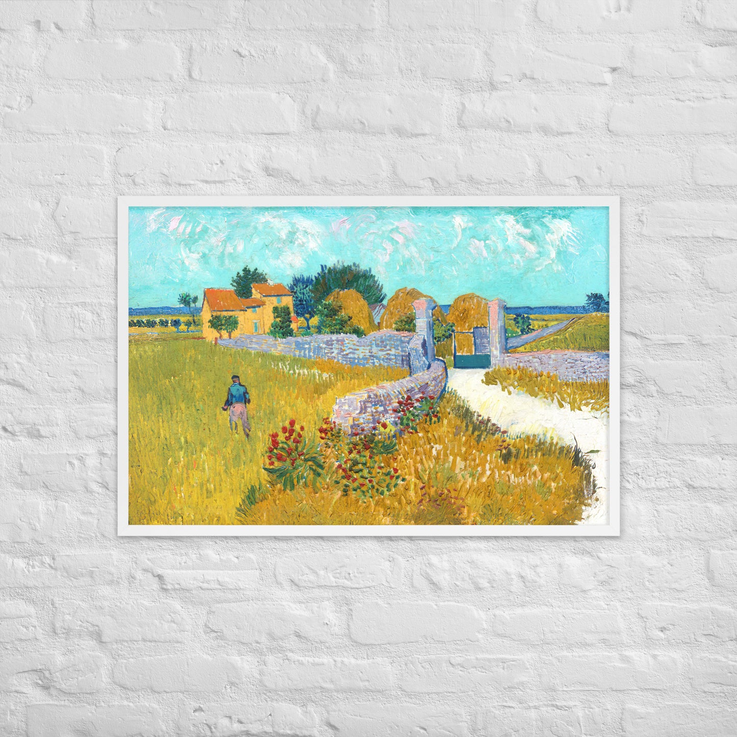 Van Gogh's 'Farmhouse in Provence' on a 24"x36" white framed poster print on a white brick wall.