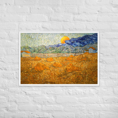 Van Gogh's 'Landscape with Wheat Sheaves and Rising Moon' on a 24"x36" white framed poster print on a white brick wall.