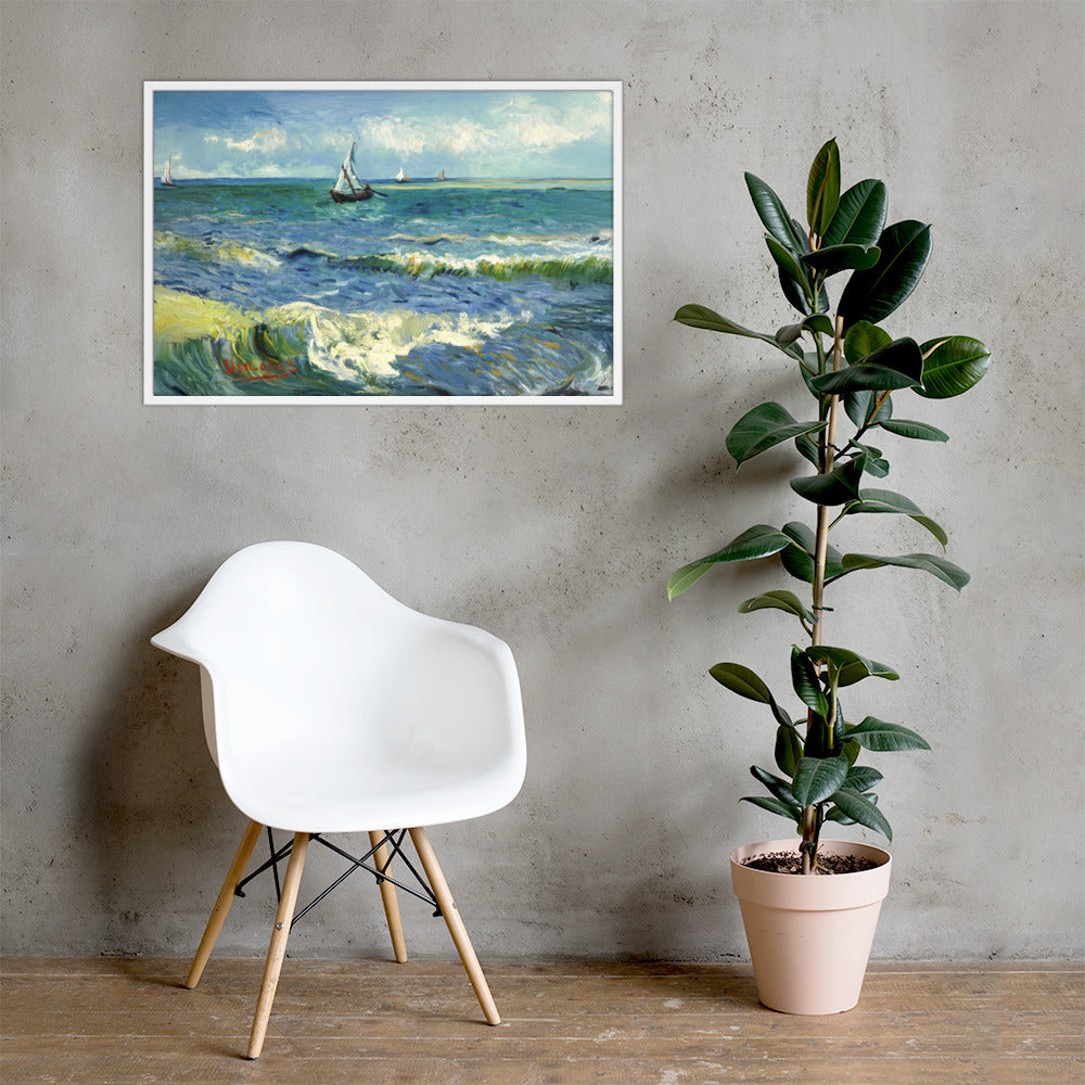 Van Gogh's 'The Sea at Les Saintes-Maries-de-la-Mer' on a 24"x36" white framed poster print on a light gray concrete wall with a white chair and plant below.