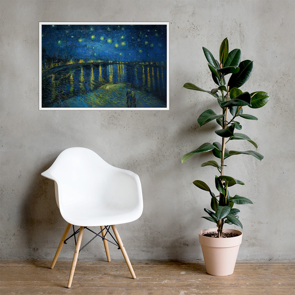 Van Gogh's 'Starry Night Over the Rhone' on a 24"x36" white framed poster print on a light gray concrete wall with a white chair and plant below.