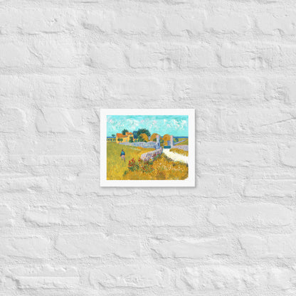 Van Gogh's 'Farmhouse in Provence' on a 8"x10" white framed poster print on a white brick wall.