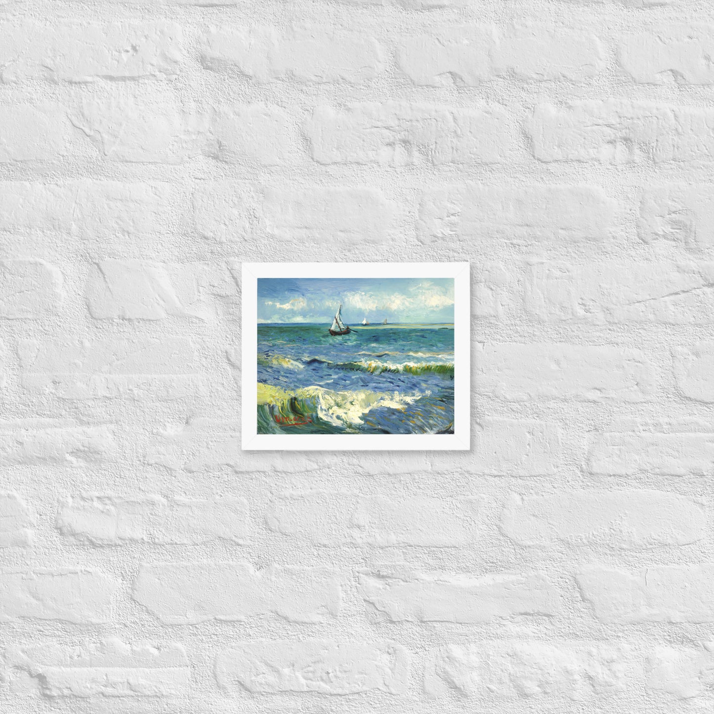 Van Gogh's 'The Sea at Les Saintes-Maries-de-la-Mer' on a 8"x10" white framed poster print on a white brick wall.