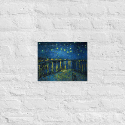 Van Gogh's 'Starry Night Over the Rhone' on a 11"x14" unframed poster print on a white brick wall.