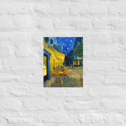 Van Gogh's 'Café Terrace at Night' on a 11"x14" unframed poster print on a white brick wall.