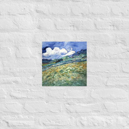 Van Gogh's 'Landscape from Saint-Rémy' on a 12"x12" unframed poster print on a white brick wall.