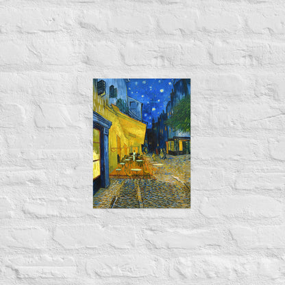 Van Gogh's 'Café Terrace at Night' on a 12"x16" unframed poster print on a white brick wall.