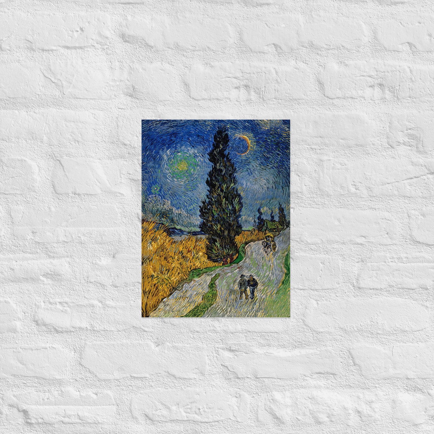 Van Gogh's 'Road with Cypress and Star' on a 12"x16" unframed poster print on a white brick wall.