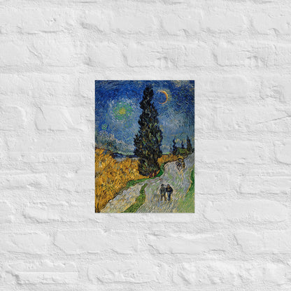 Van Gogh's 'Road with Cypress and Star' on a 12"x16" unframed poster print on a white brick wall.