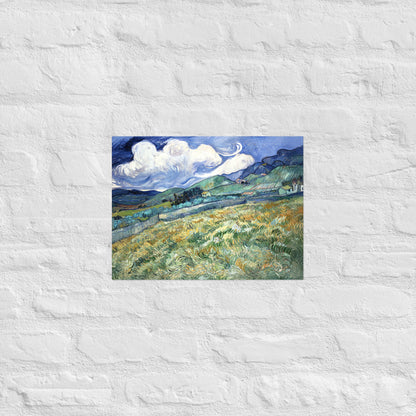 Van Gogh's 'Landscape from Saint-Rémy' on a 12"x16" unframed poster print on a white brick wall.