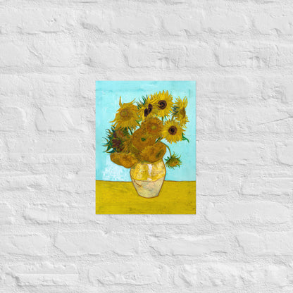 Van Gogh's 'Vase with Twelve Sunflowers' on a 12"x16" unframed poster print on a white brick wall.