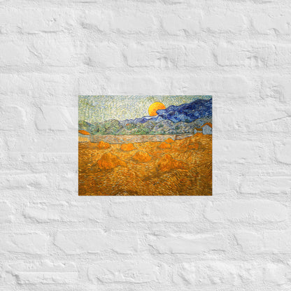 Van Gogh's 'Landscape with Wheat Sheaves and Rising Moon' on a 12"x16" unframed poster print on a white brick wall.