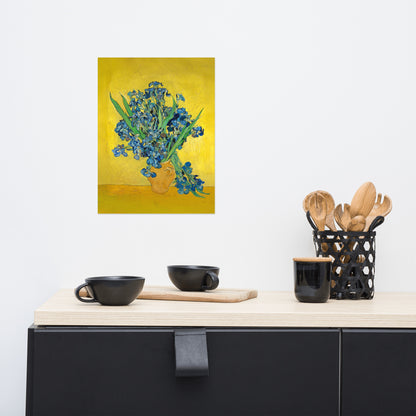 Van Gogh's 'Vase with Irises Against a Yellow Background' on a 12"x16" unframed poster print on a white wall above a kitchen counter with cooking supplies.