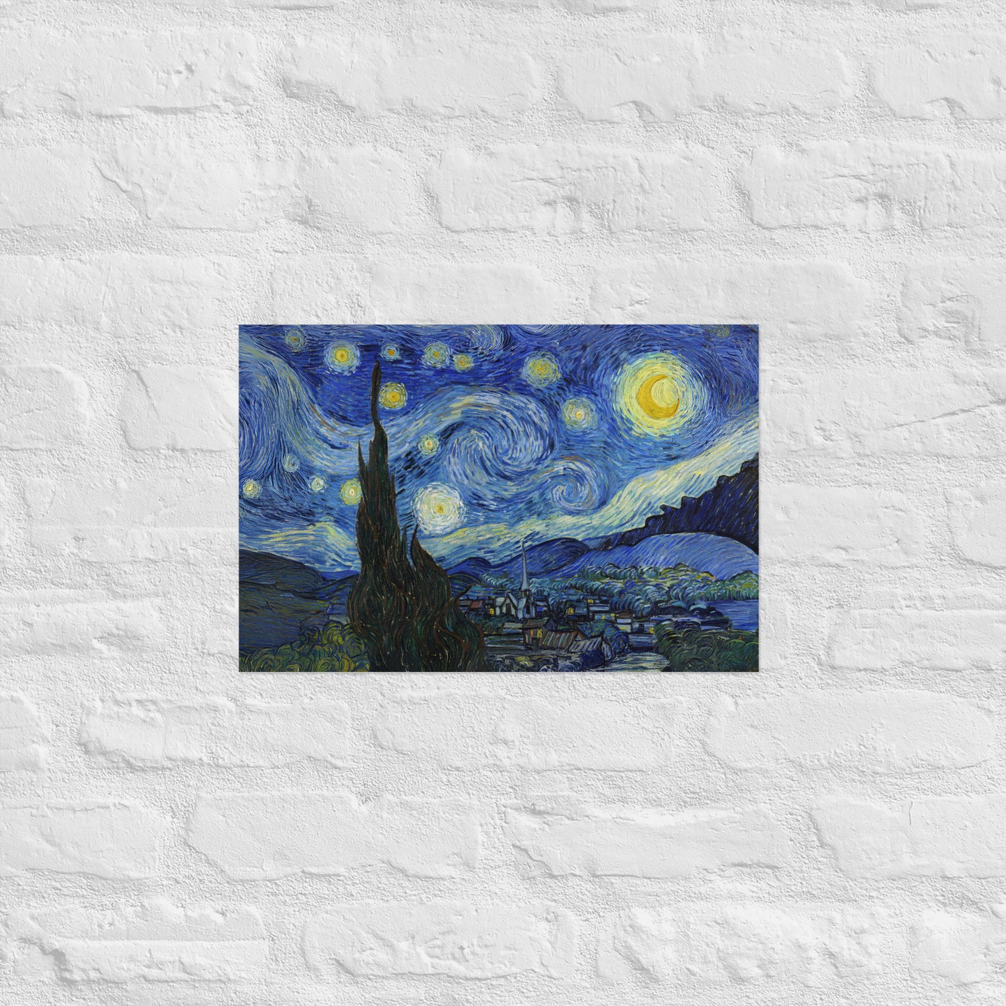Van Gogh's 'Starry Night' on a 12"x18" unframed poster print on a white brick wall.
