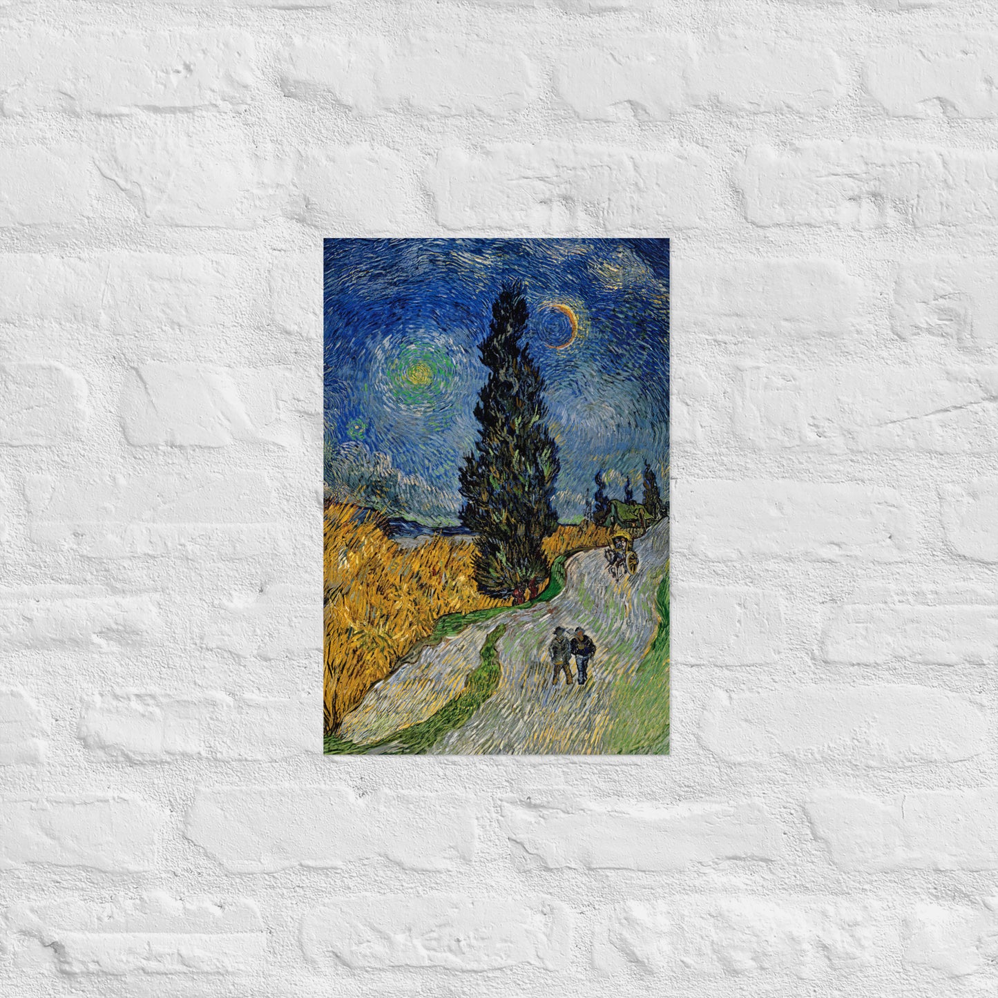 Van Gogh's 'Road with Cypress and Star' on a 12"x18" unframed poster print on a white brick wall.