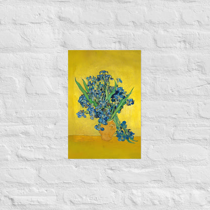Van Gogh's 'Vase with Irises Against a Yellow Background' on a 12"x18" unframed poster print on a white brick wall.
