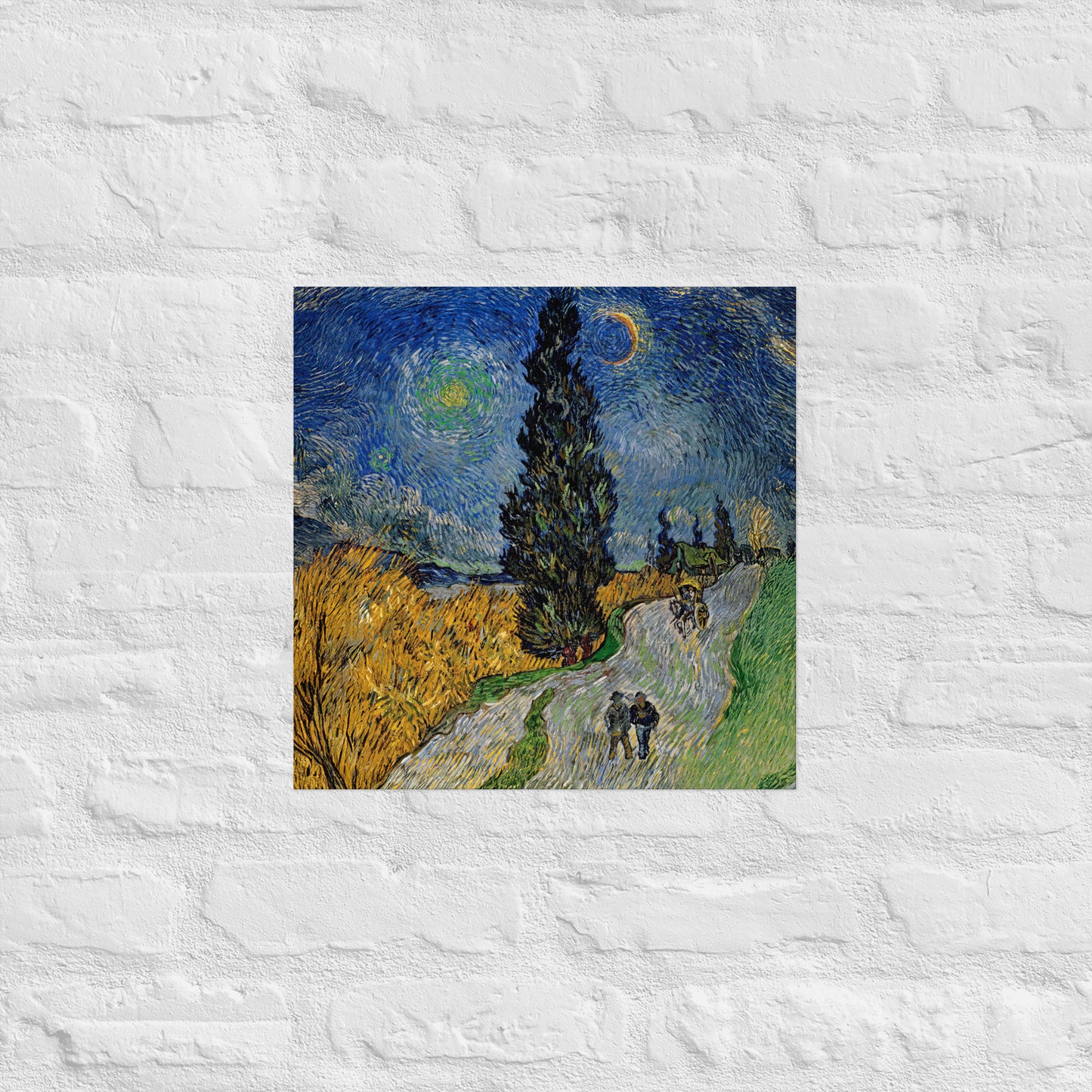 Van Gogh's 'Road with Cypress and Star' on a 16"x16" unframed poster print on a white brick wall.