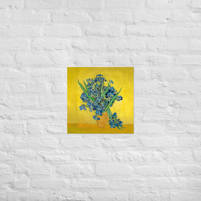 Van Gogh's 'Vase with Irises Against a Yellow Background' on a 18"x18" unframed poster print on a white brick wall.