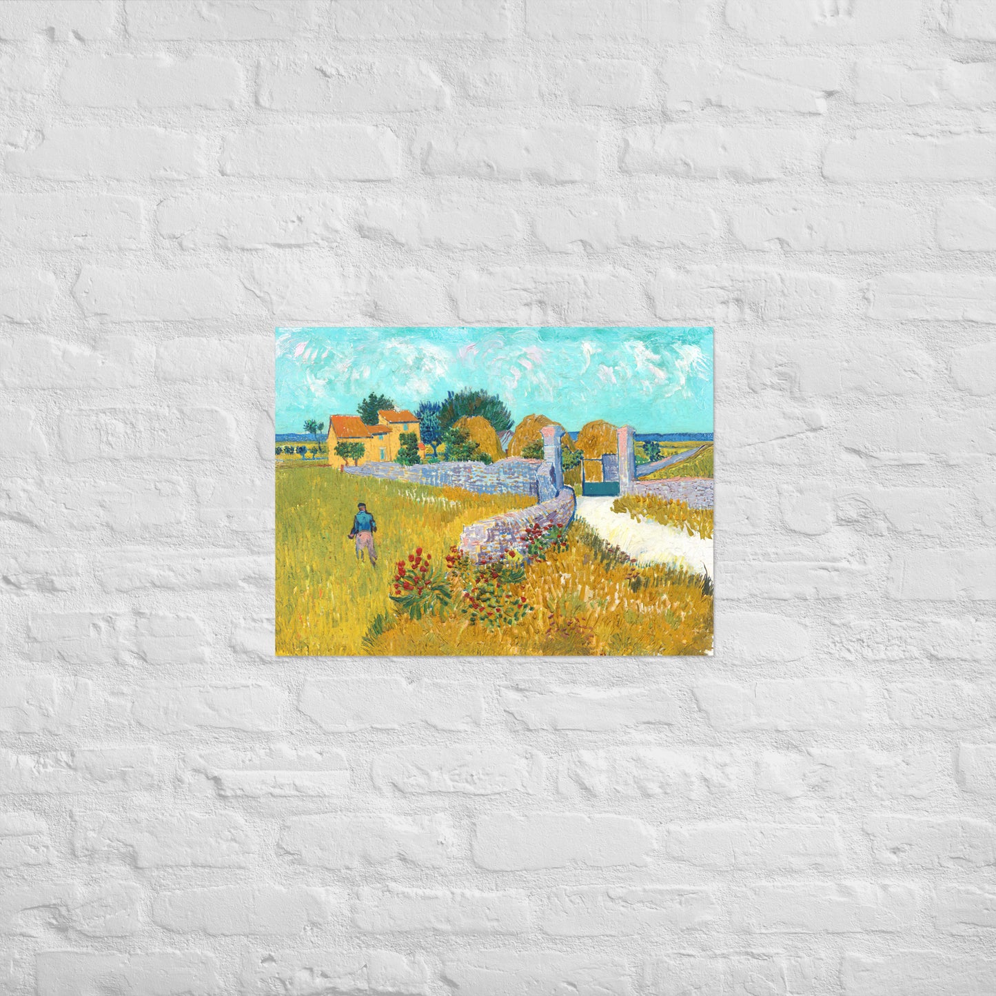 Van Gogh's 'Farmhouse in Provence' on a 18"x24" unframed poster print on a white brick wall.