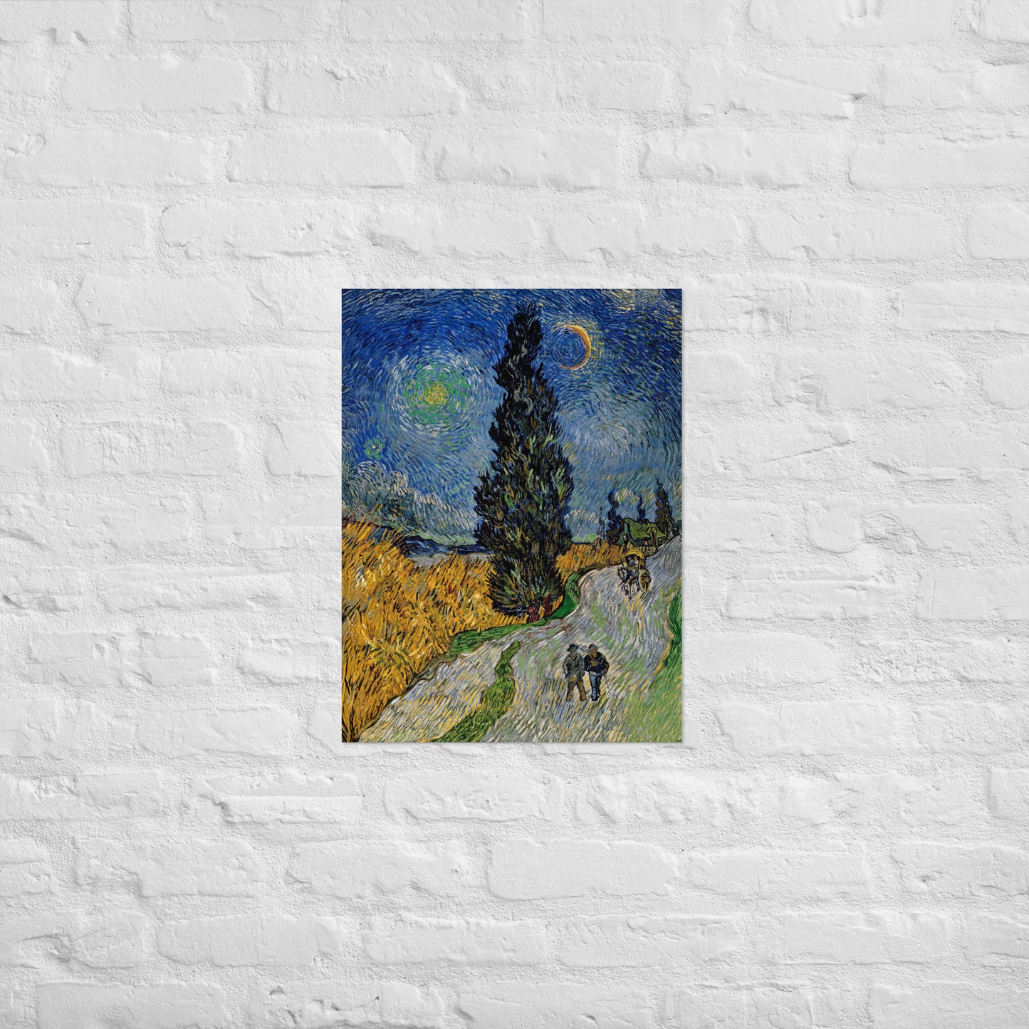 Van Gogh's 'Road with Cypress and Star' on a 18"x24" unframed poster print on a white brick wall.
