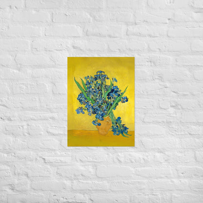 Van Gogh's 'Vase with Irises Against a Yellow Background' on a 18"x24" unframed poster print on a white brick wall.