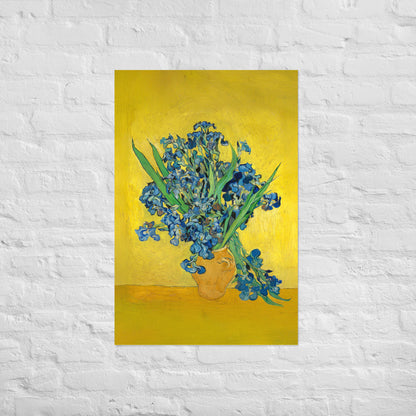 Van Gogh's 'Vase with Irises Against a Yellow Background' on a 24"x36" unframed poster print on a white brick wall.