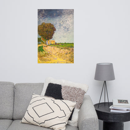 Van Gogh's 'A Lane near Arles' on a 24"x36" unframed poster print on a white wall above a gray sofa with throw pillows and side table with a lamp.