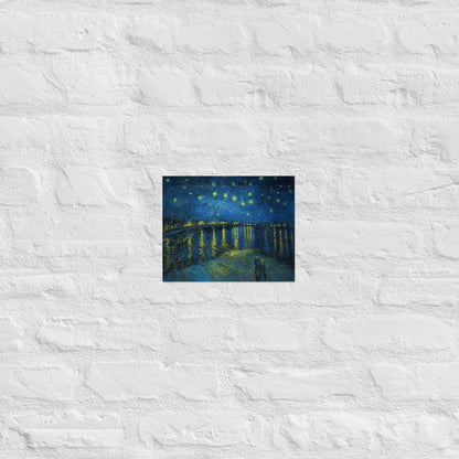 Van Gogh's 'Starry Night Over the Rhone' on a 8"x10" unframed poster print on a white brick wall.