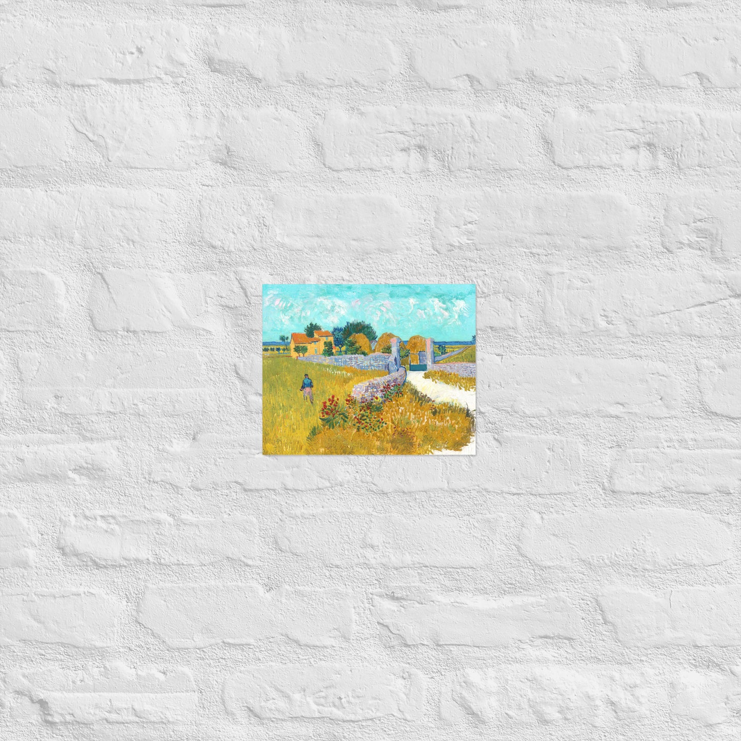 Van Gogh's 'Farmhouse in Provence' on a 8"x10" unframed poster print on a white brick wall.