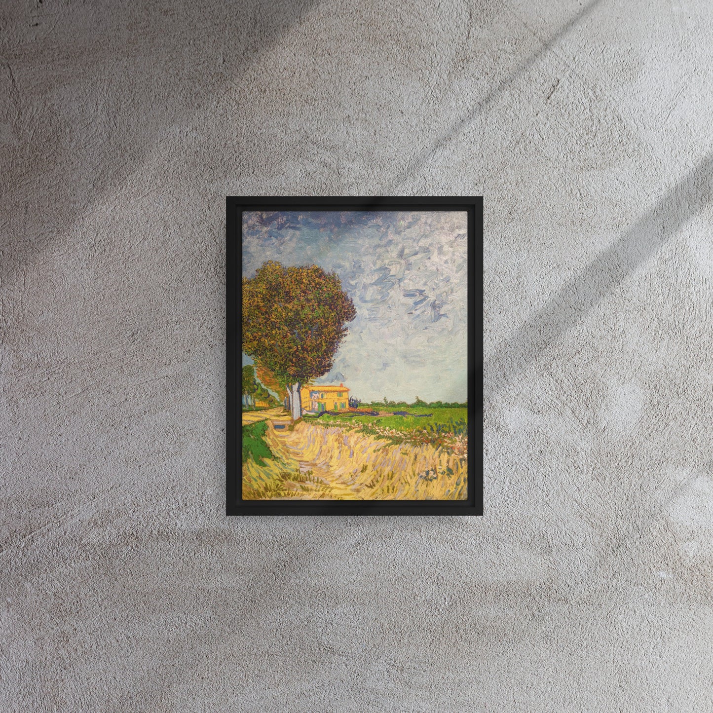 Van Gogh's 'A Lane near Arles' on a 11"x14" black framed canvas print on a textured gray wall.