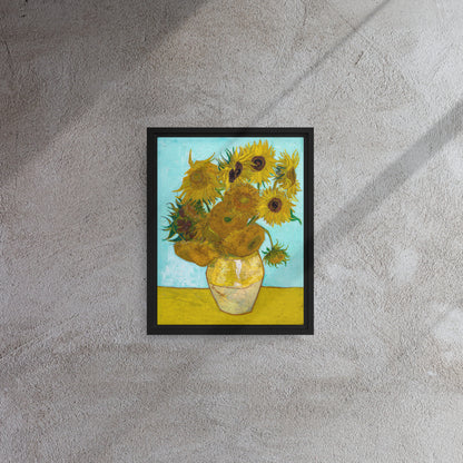 Van Gogh's 'Vase with Twelve Sunflowers' on a 11"x14" black framed canvas print on a textured gray wall.