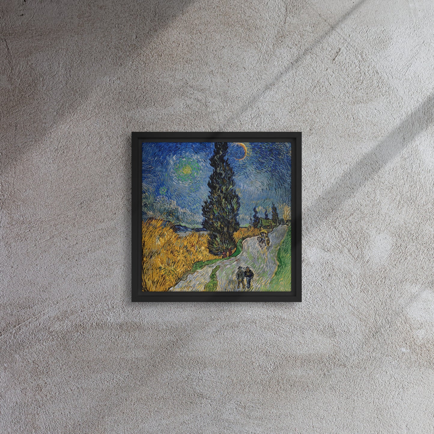 Van Gogh's 'Road with Cypress and Star' on a 12"x12" black framed canvas print on a textured gray wall.
