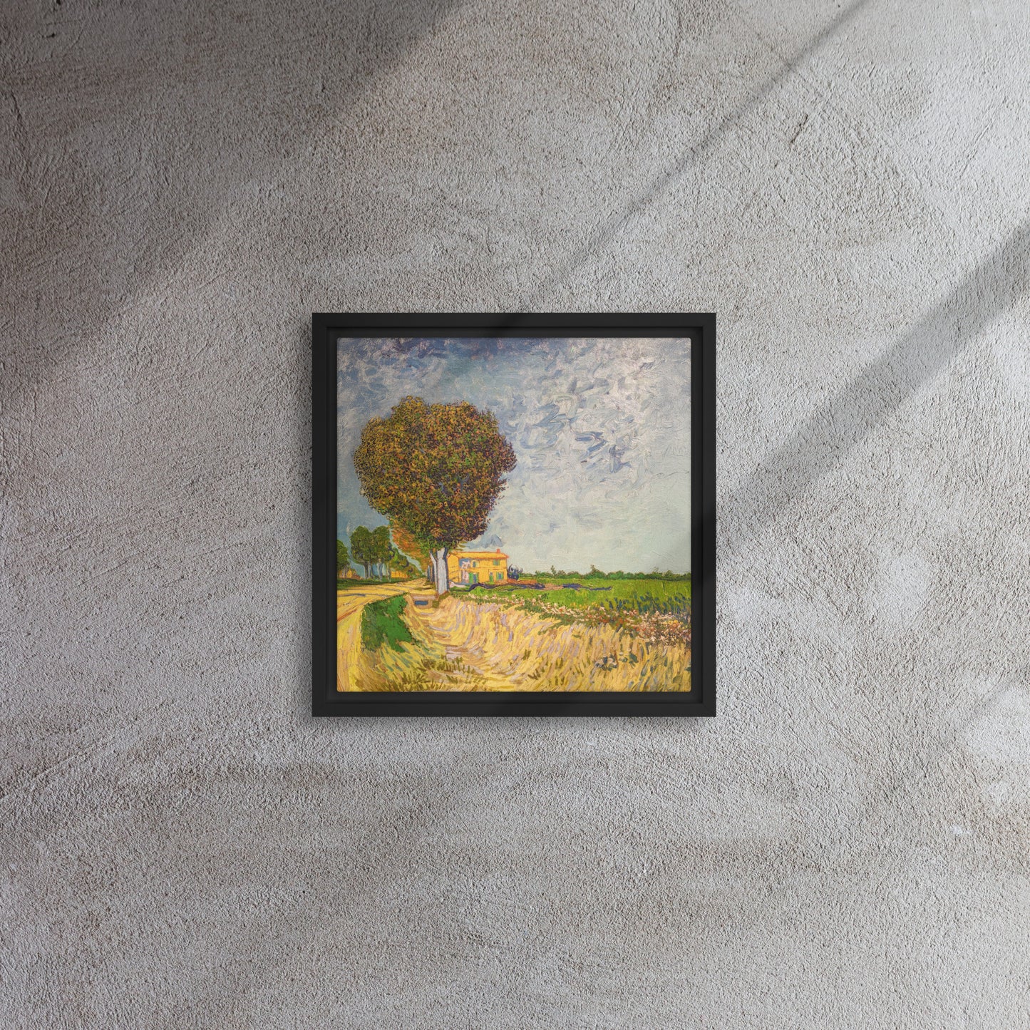 Van Gogh's 'A Lane near Arles' on a 12"x12" black framed canvas print on a textured gray wall.