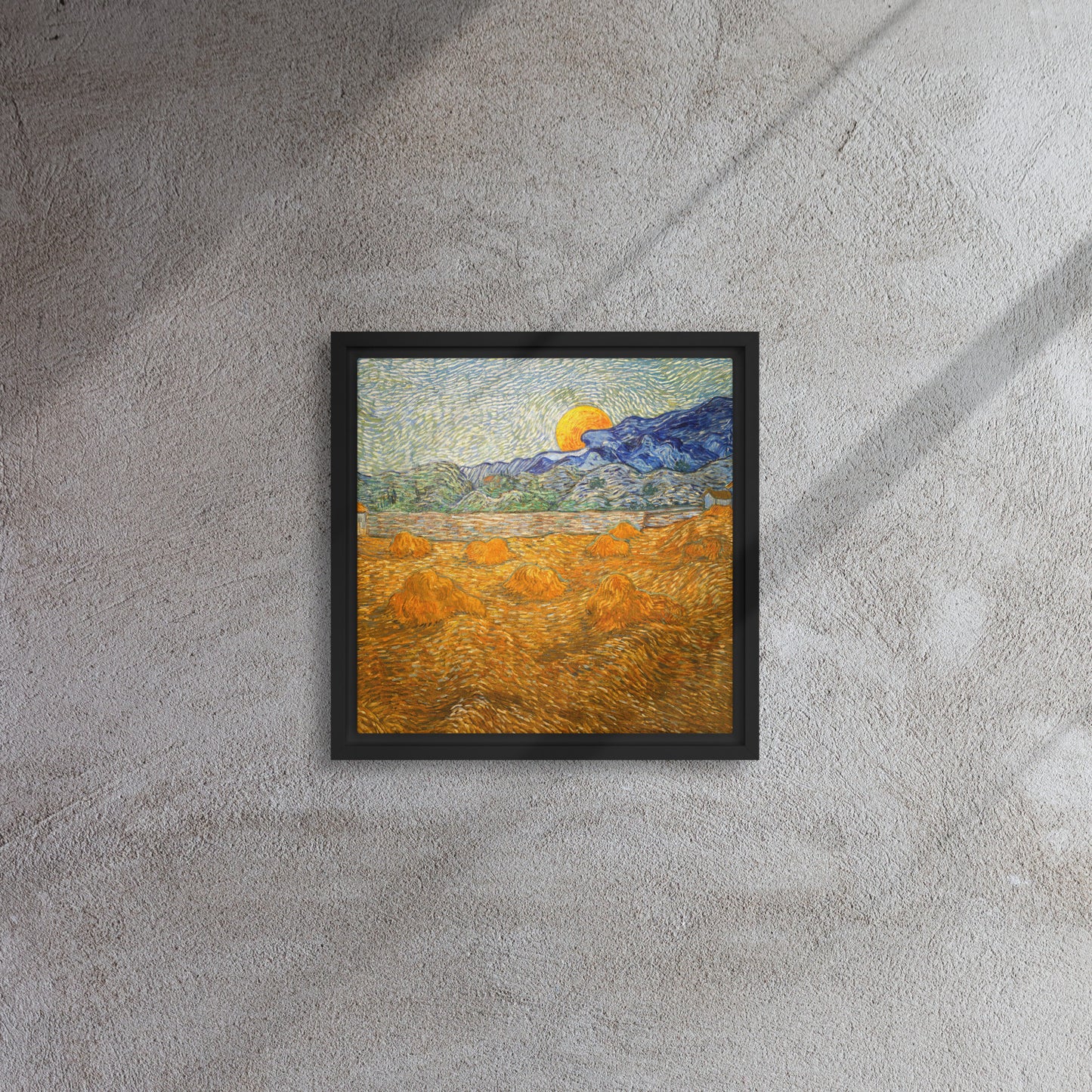 Van Gogh's 'Landscape with Wheat Sheaves and Rising Moon' on a 12"x12" black framed canvas print on a textured gray wall.
