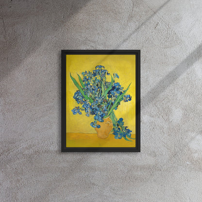 Van Gogh's 'Vase with Irises Against a Yellow Background' on a 12"x16" black framed canvas print on a textured gray wall.