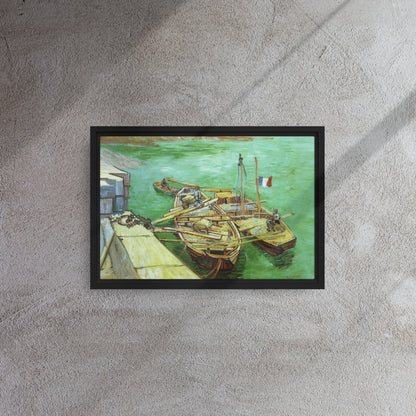 Van Gogh's 'Quay with Men Unloading Sand Barges' on a 12"x18" black framed canvas print on a textured gray wall.