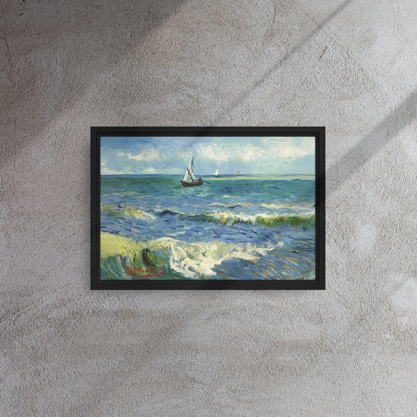 Van Gogh's 'The Sea at Les Saintes-Maries-de-la-Mer' on a 12"x18" black framed canvas print on a textured gray wall.