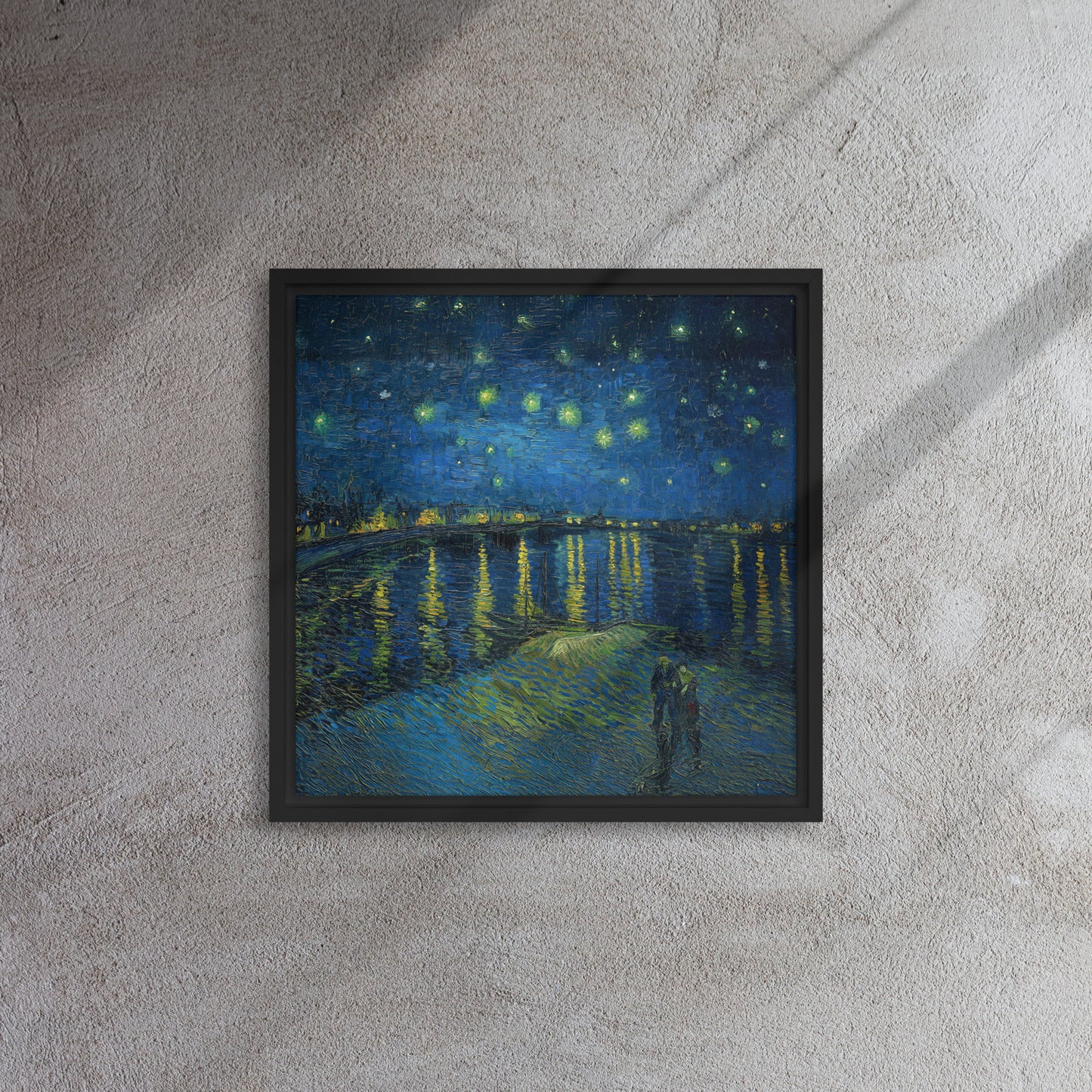 Van Gogh's 'Starry Night Over the Rhone' on a 16"x16" black framed canvas print on a textured gray wall.