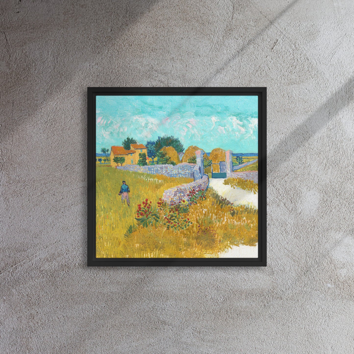 Van Gogh's 'Farmhouse in Provence' on a 16"x16" black framed canvas print on a textured gray wall.