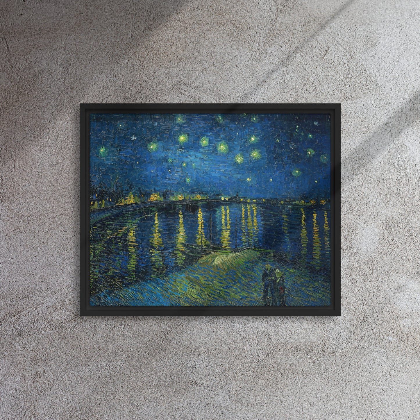 Van Gogh's 'Starry Night Over the Rhone' on a 16"x20" black framed canvas print on a textured gray wall.