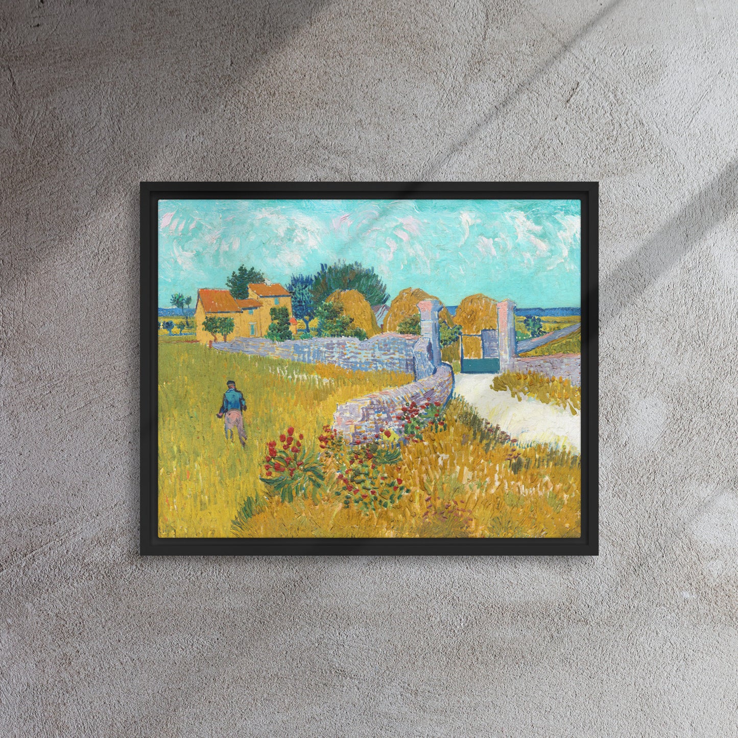 Van Gogh's 'Farmhouse in Provence' on a 16"x20" black framed canvas print on a textured gray wall.
