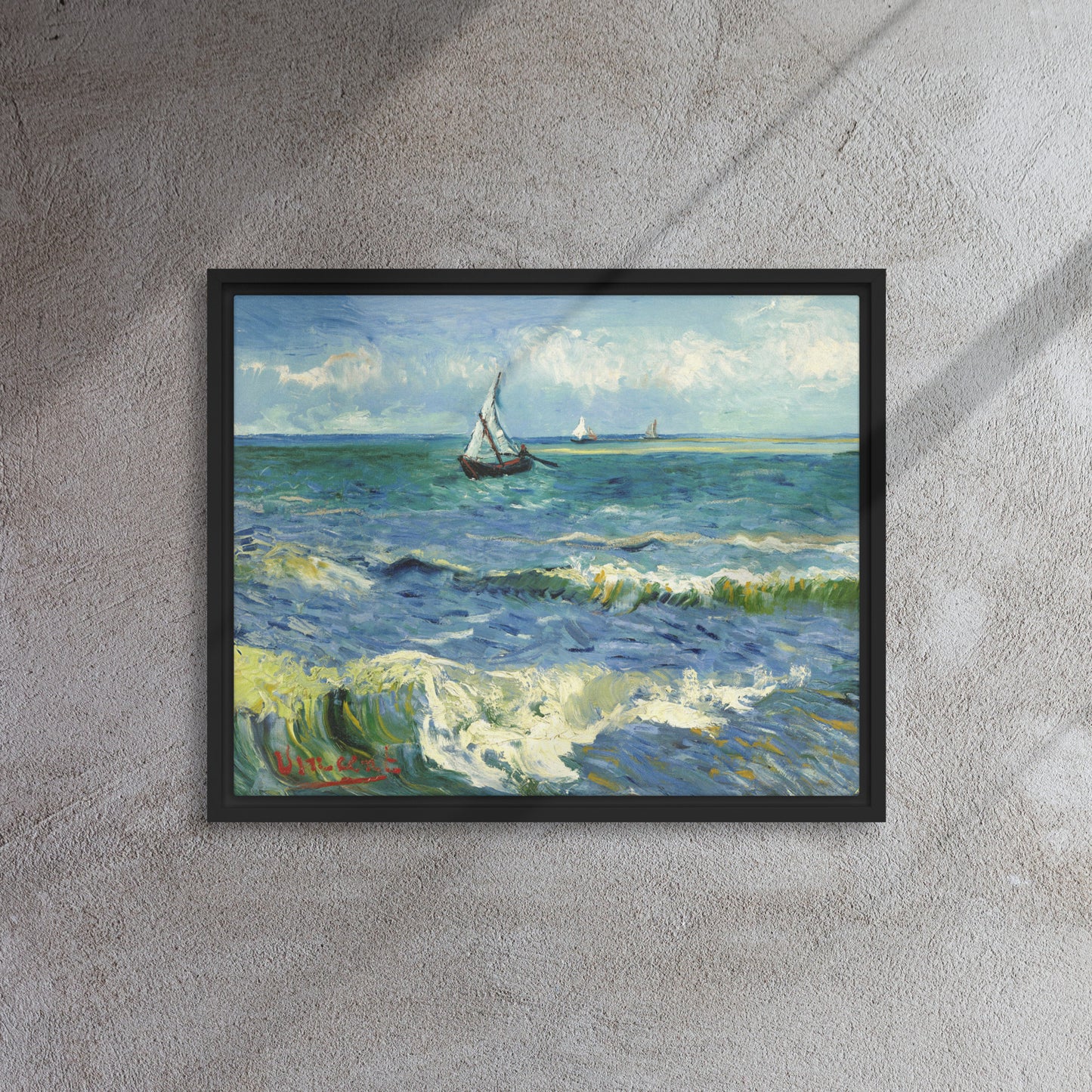 Van Gogh's 'The Sea at Les Saintes-Maries-de-la-Mer' on a 16"x20" black framed canvas print on a textured gray wall.