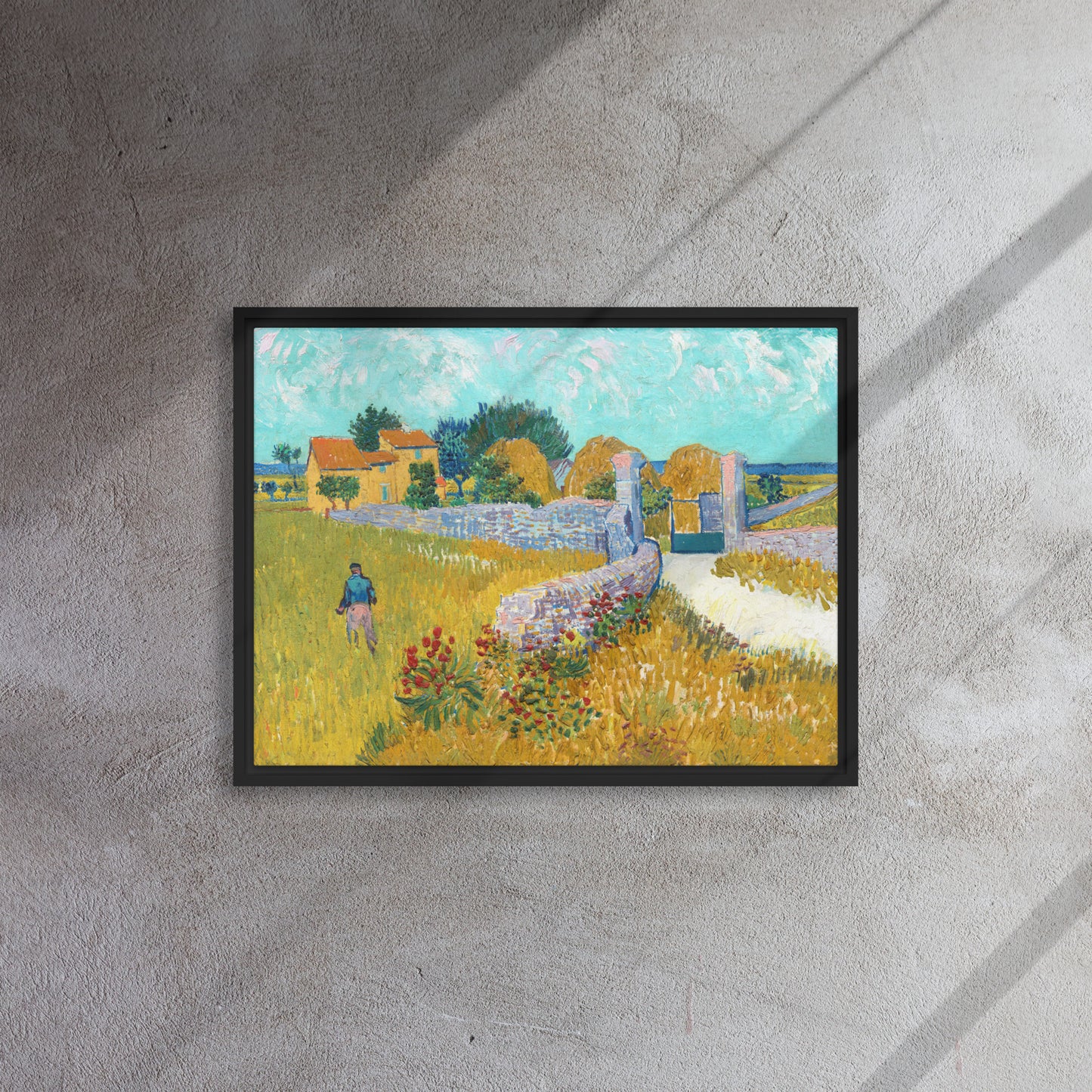 Van Gogh's 'Farmhouse in Provence' on a 18"x24" black framed canvas print on a textured gray wall.