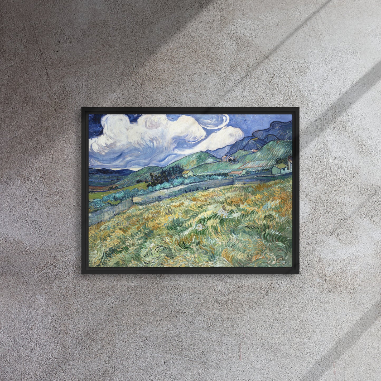Van Gogh's 'Landscape from Saint-Rémy' on a 18"x24" black framed canvas print on a textured gray wall.