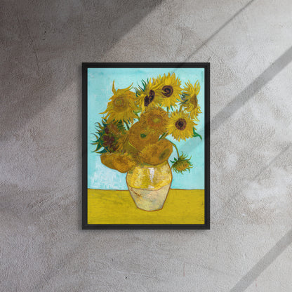 Van Gogh's 'Vase with Twelve Sunflowers' on a 18"x24" black framed canvas print on a textured gray wall.