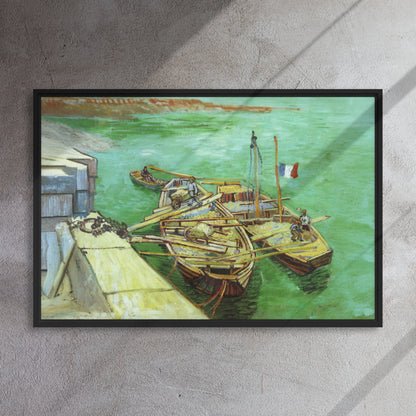 Van Gogh's 'Quay with Men Unloading Sand Barges' on a 24"x36" black framed canvas print on a textured gray wall.