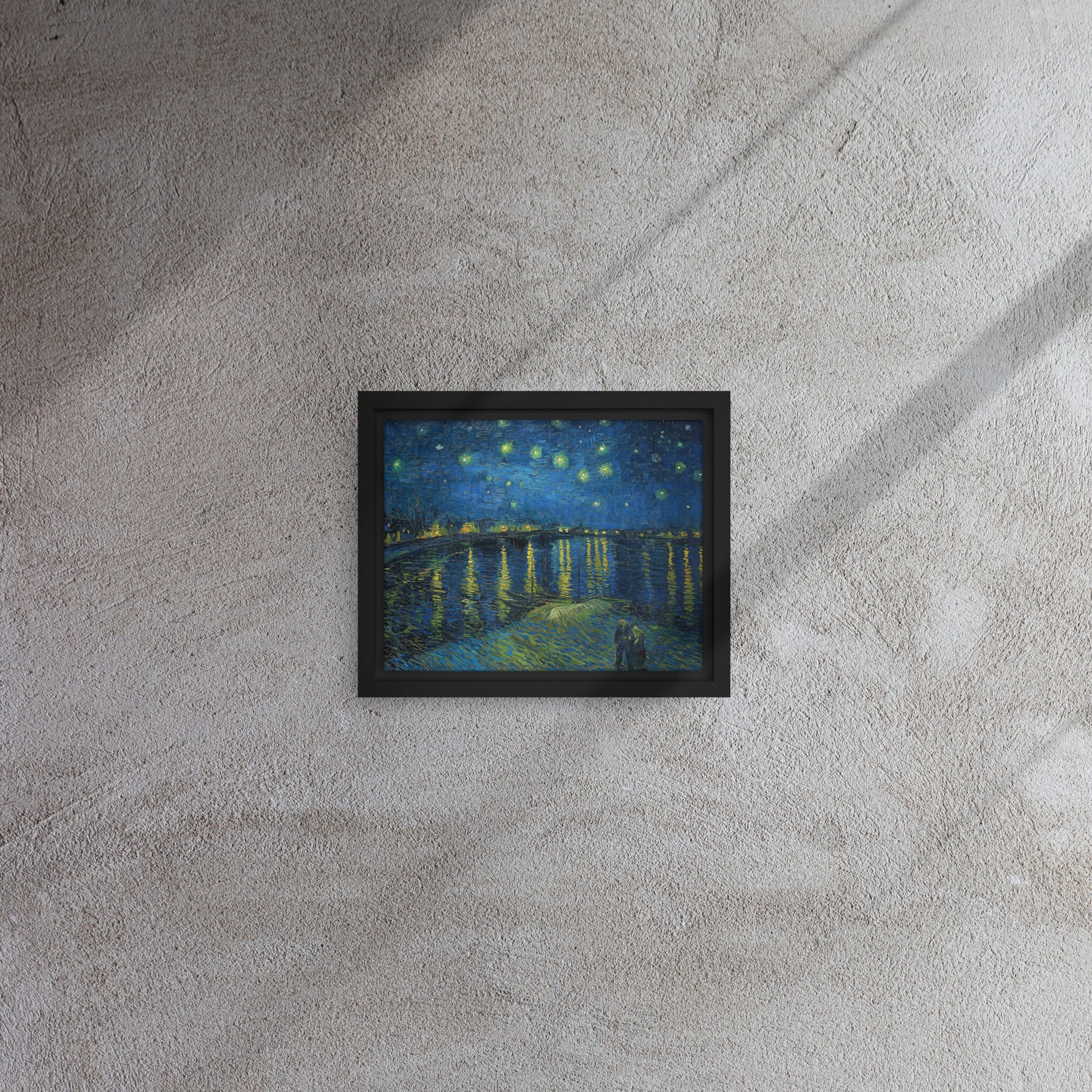 Van Gogh's 'Starry Night Over the Rhone' on a 8"x10" black framed canvas print on a textured gray wall.